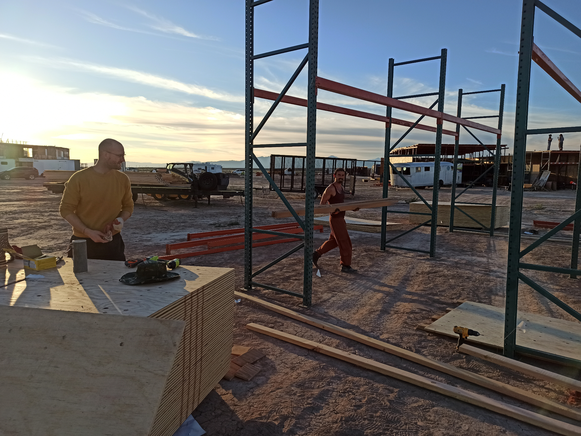 Bodhi and Magnus building the dojo frame at sunset